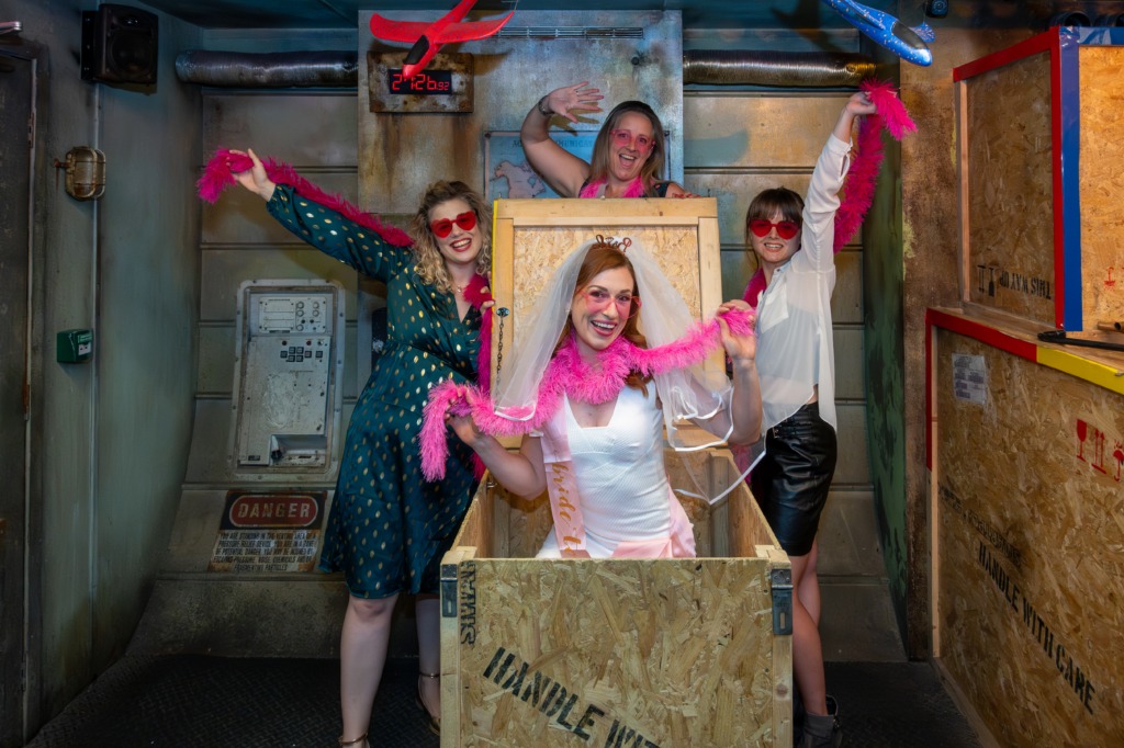 A bride gets in a crate during her hen party