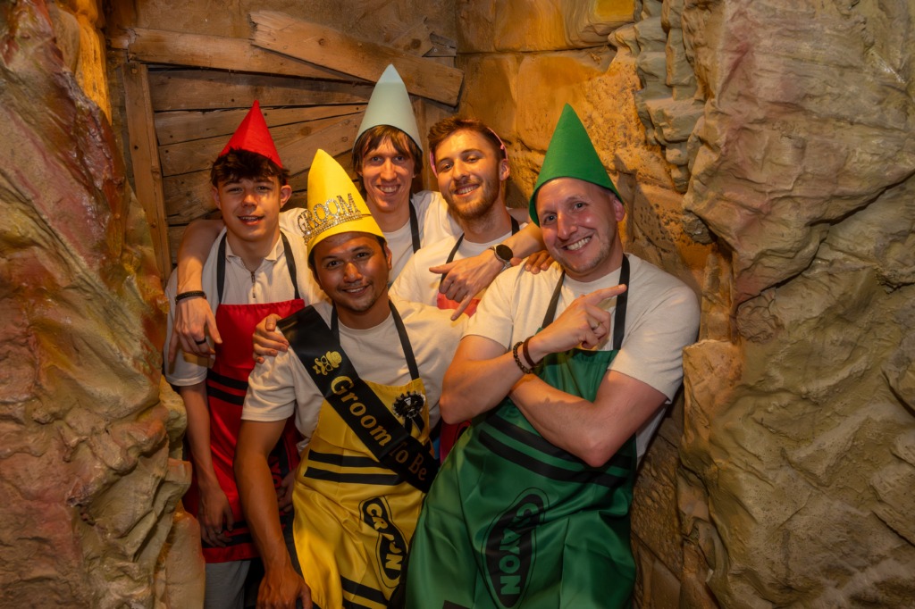 A stag party in a cave as part of an escape room set